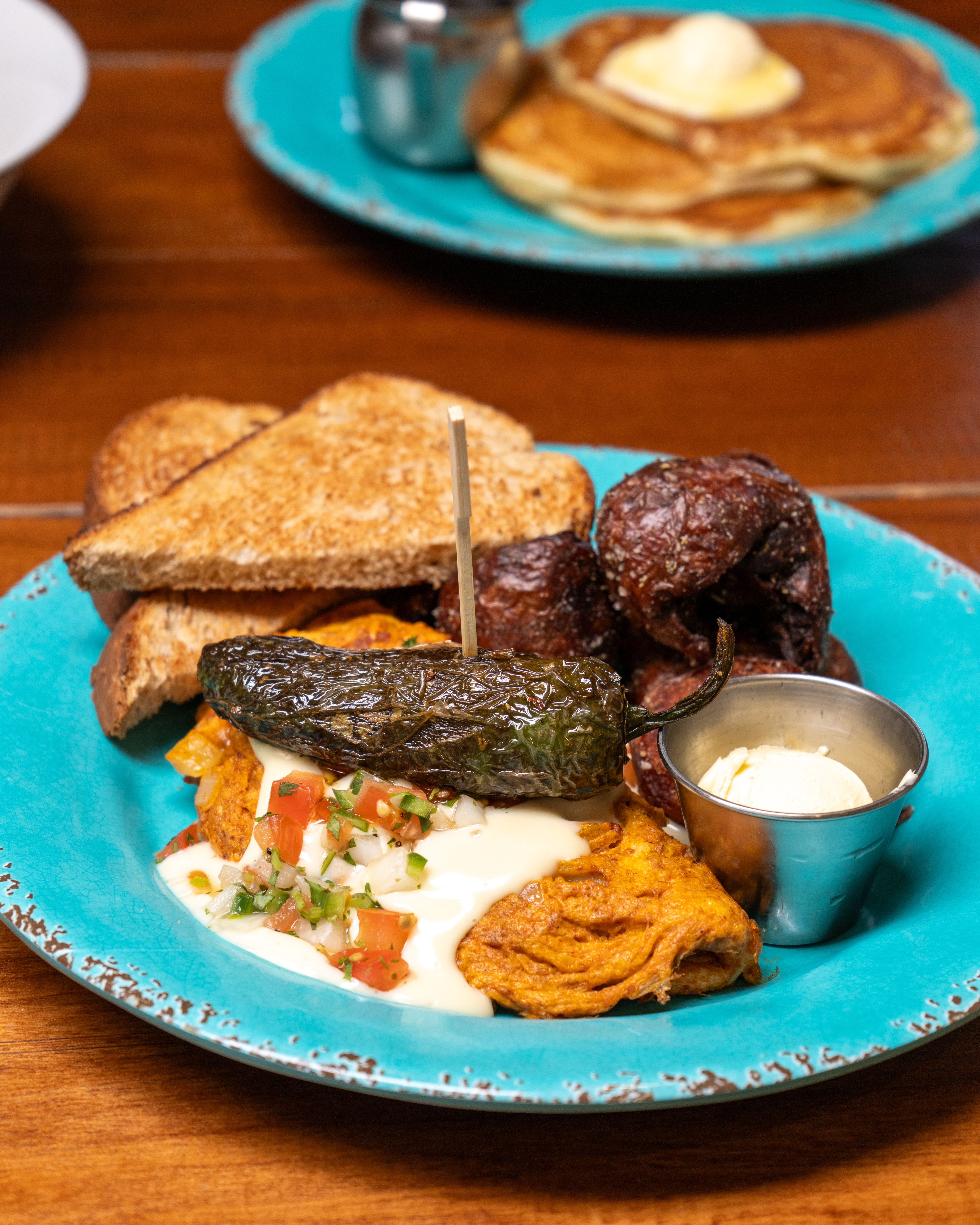 Chorizo Omelet with fried whole jalapeno and Pioneer Potatoes
